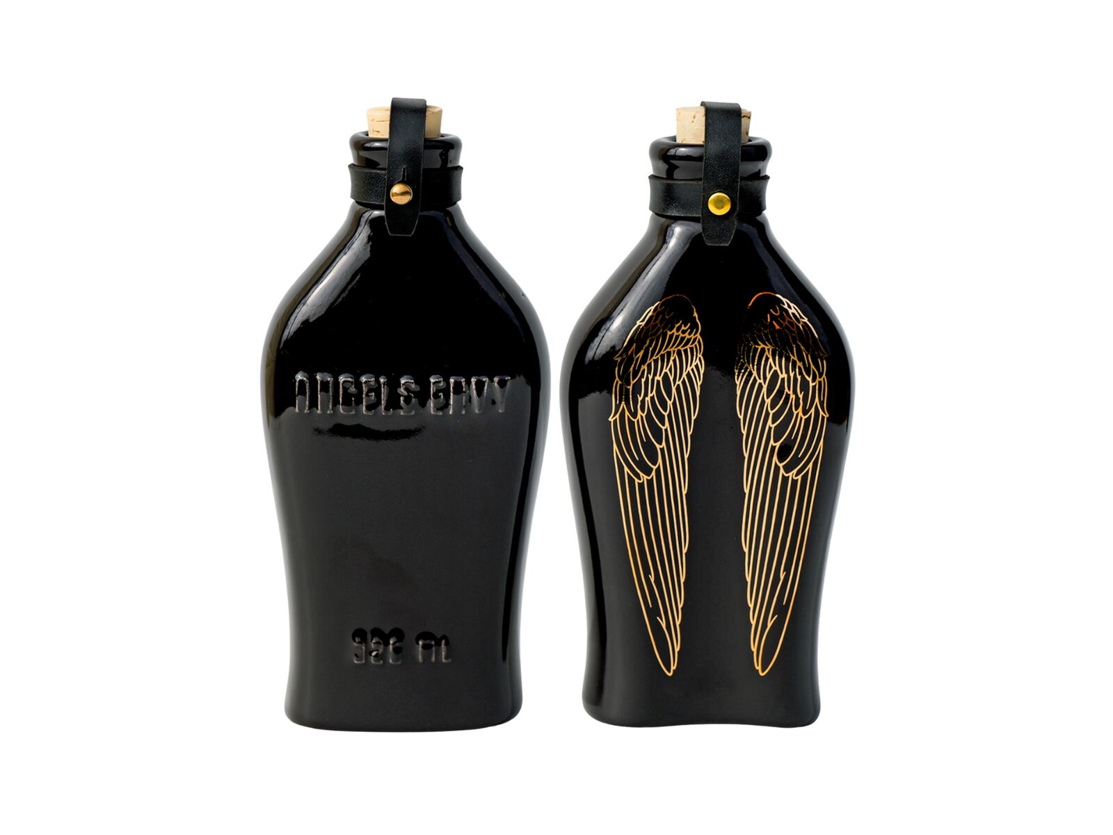 The black Angel’s Envy Ceramic Flask featuring wings in patent gold, a tonal embossed logo, tonal leather straps and a beige cork.