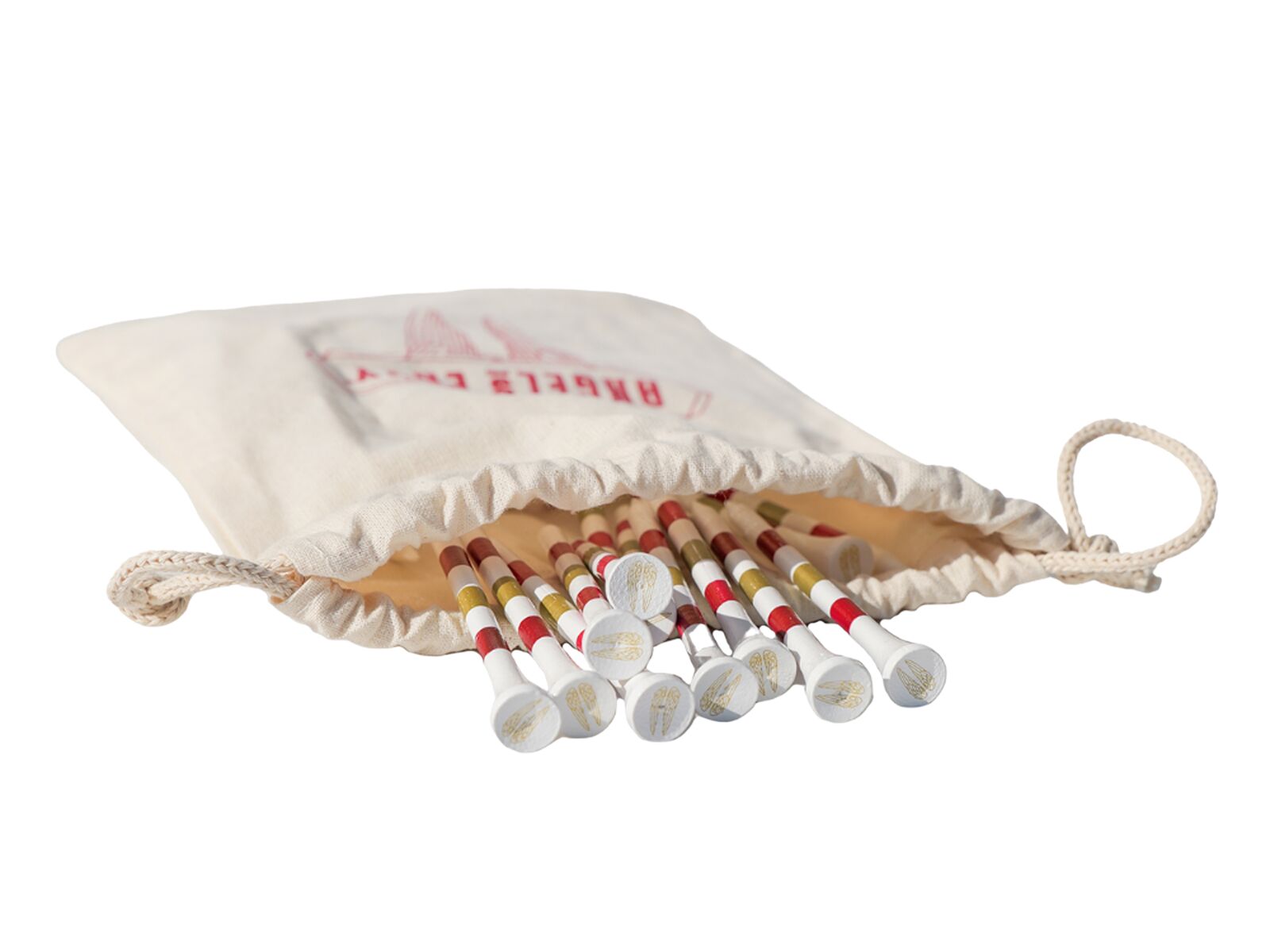 The white Angel’s Envy Golf Tees with ruby, gold, and red stripes spilling out of a beige canvas bag.