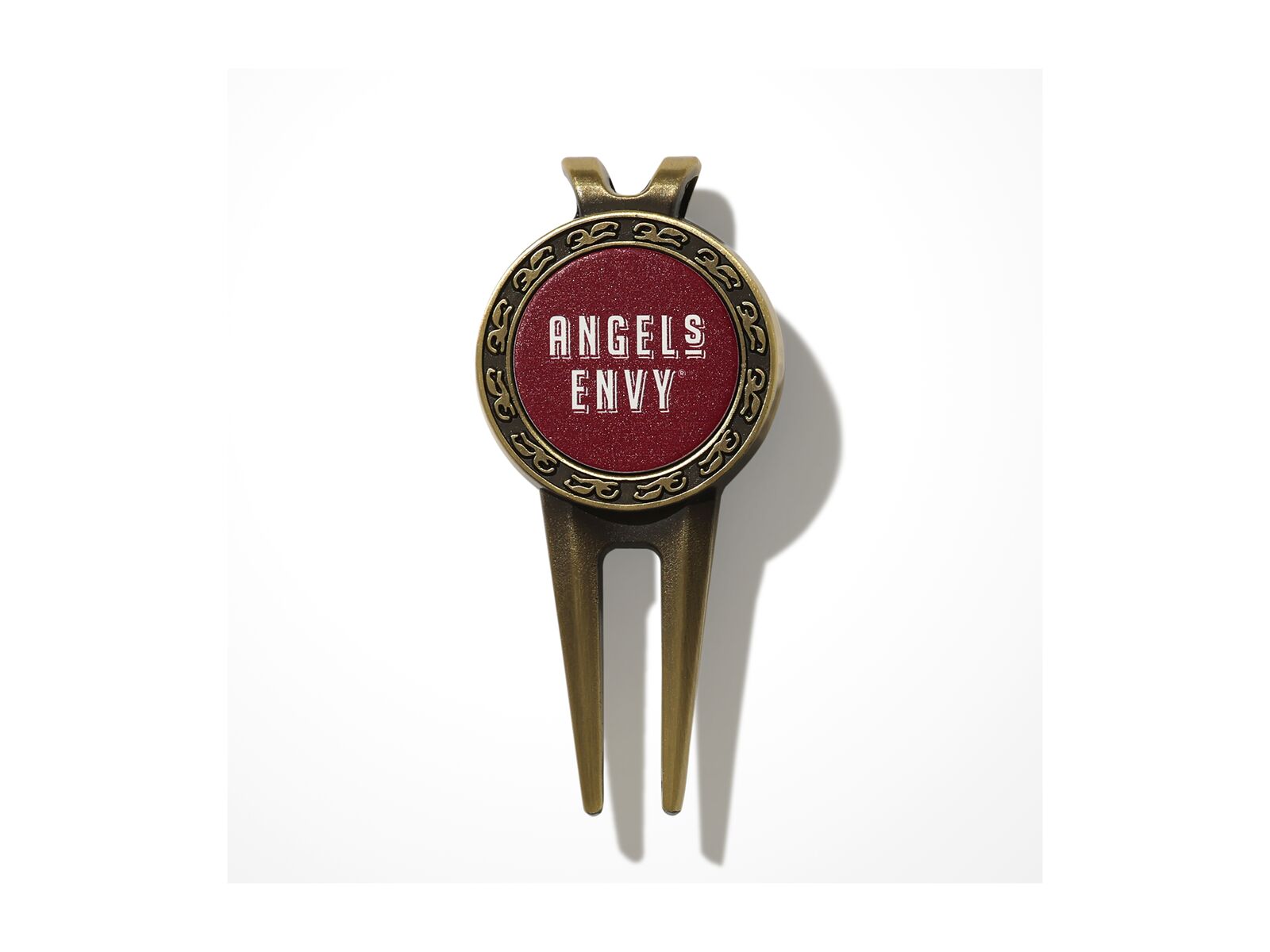 The bronze and ruby Angel’s Envy Golf Divot Tool featuring a logo in white.