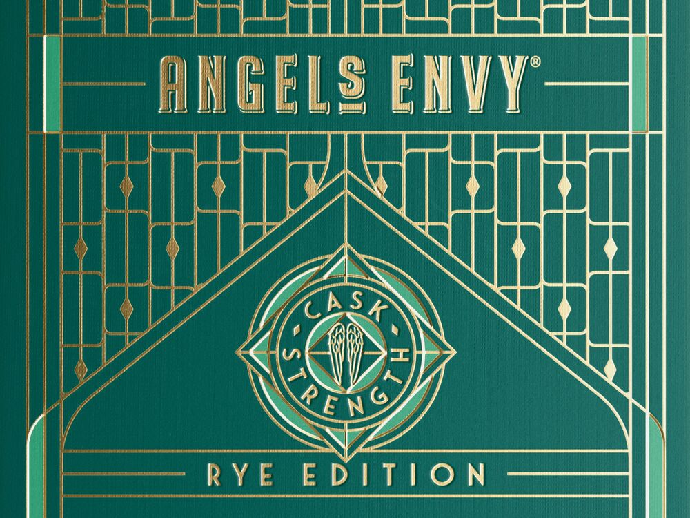 A close-up of the Angel’s Envy 10 Cask Strength Rye limited-edition presentation box in emerald green and gold.