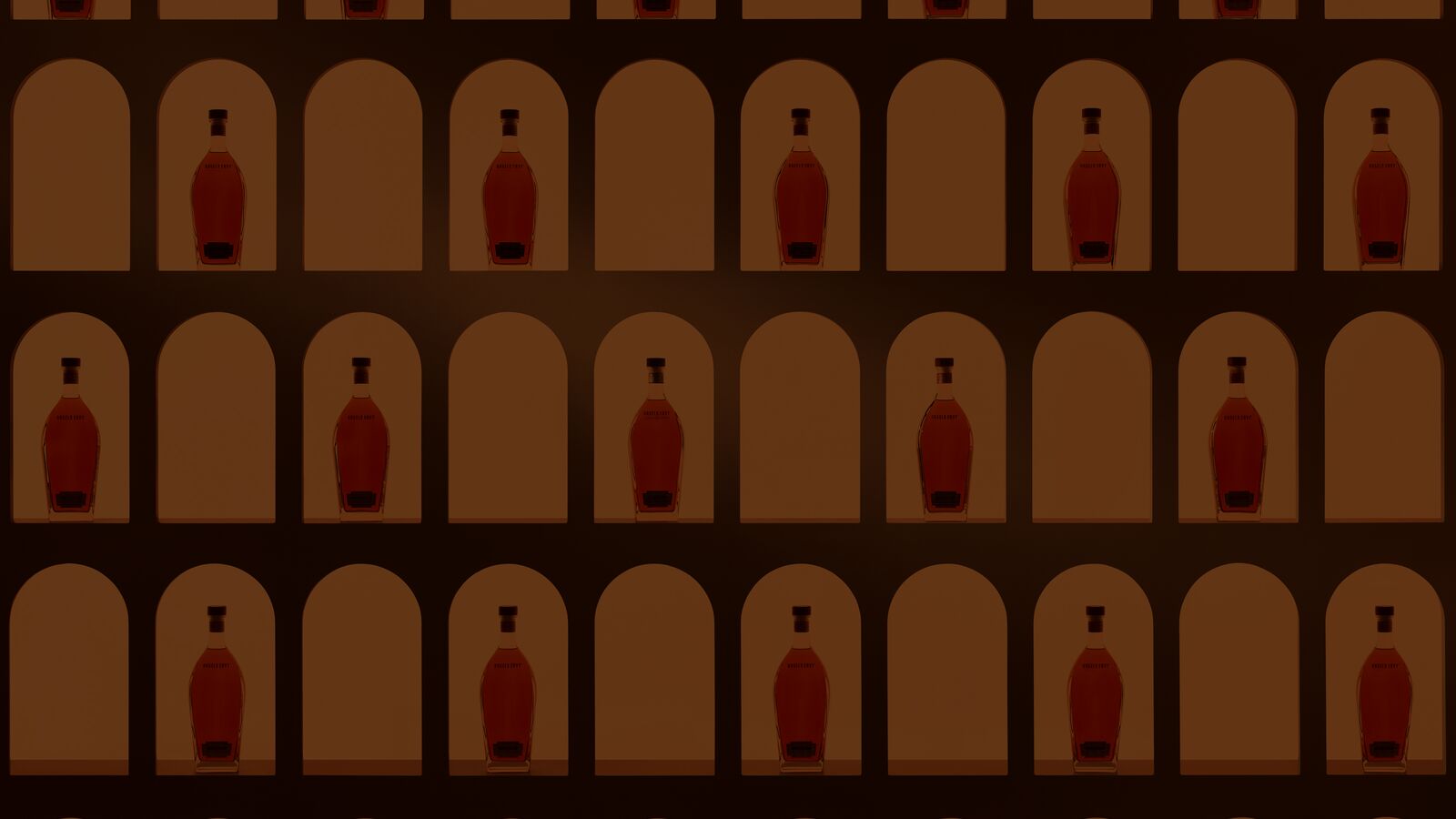 A presentation wall of Angel’s Envy bottles being highlighted in golden archways within the Cask Archive room.