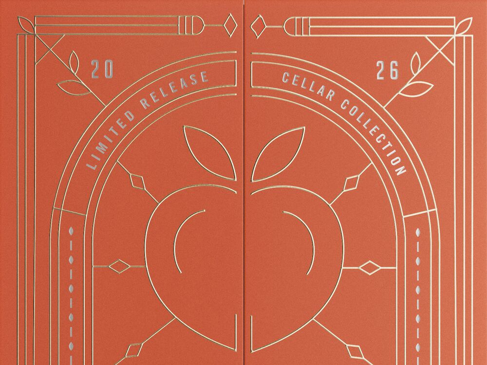 A peach-colored decorative Angel’s Envy presentation box embossed with motifs inspired by a peach orchard.