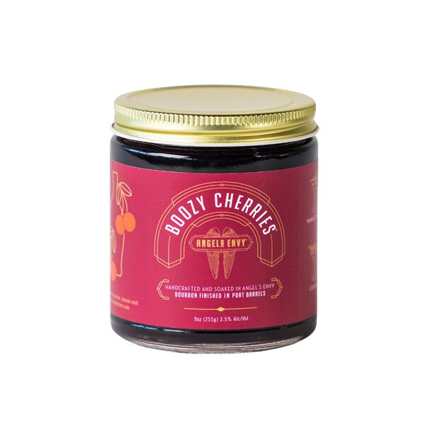 A nine ounce jar of Angel’s Envy Boozy Cherries with a burgundy label and gold lid.
